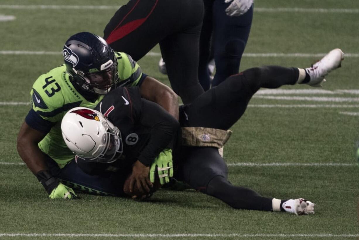 Seattle Seahawks defensive end Carlos Dunlap II (43) sacks Arizona Cardinals quarterback Kyler Murray on fourth down late in the fourth quarter Thursday, Nov. 19, 2020, in Seattle. The sack sealed the Seahawks&#039; 28-21 win.