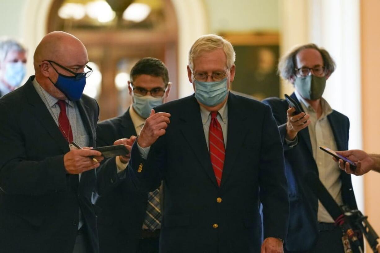 Senate Majority Leader Mitch McConnell of Ky., talks with reporters after he spoke on the Senate floor Monday, Nov. 9, 2020, at the Capitol in Washington.