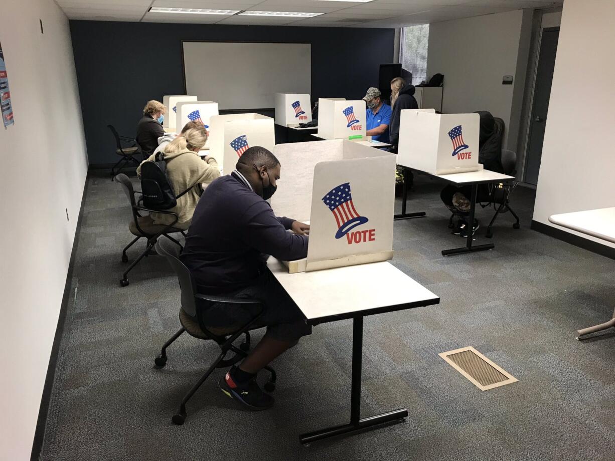 Voters cast ballots at the Clark County  Elections in downtown Vancouver on Election Day.