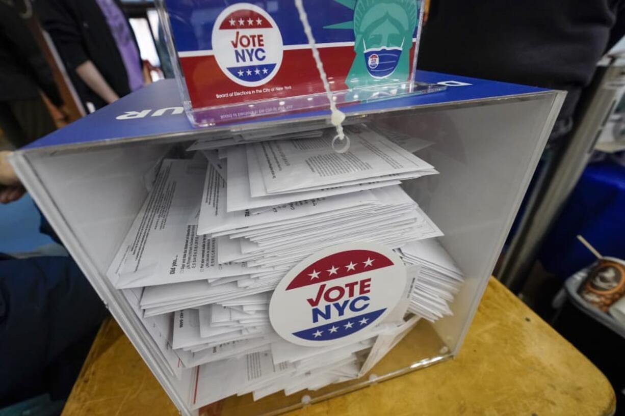 Absentee ballots are seen in a locked ballot box during early voting at the Park Slope Armory YMCA, Tuesday, Oct. 27, 2020, in the Brooklyn borough of New York.