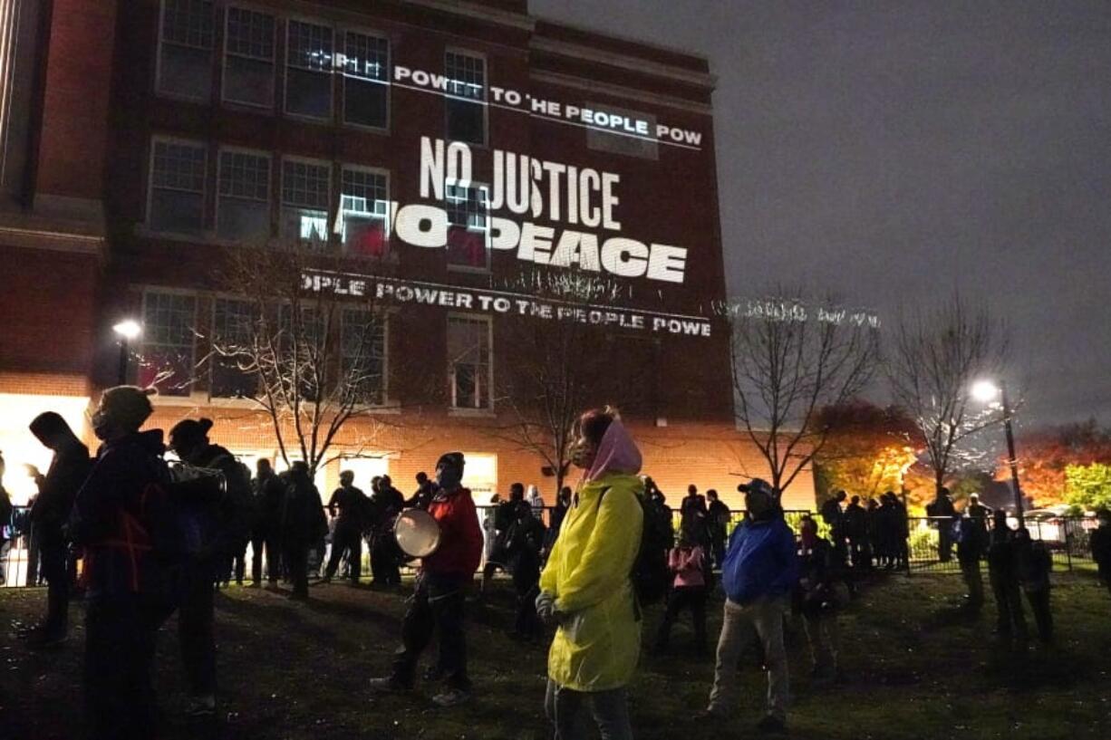 People prepare to march on the night of the election, Tuesday, Nov. 3, 2020, in Portland, Ore.