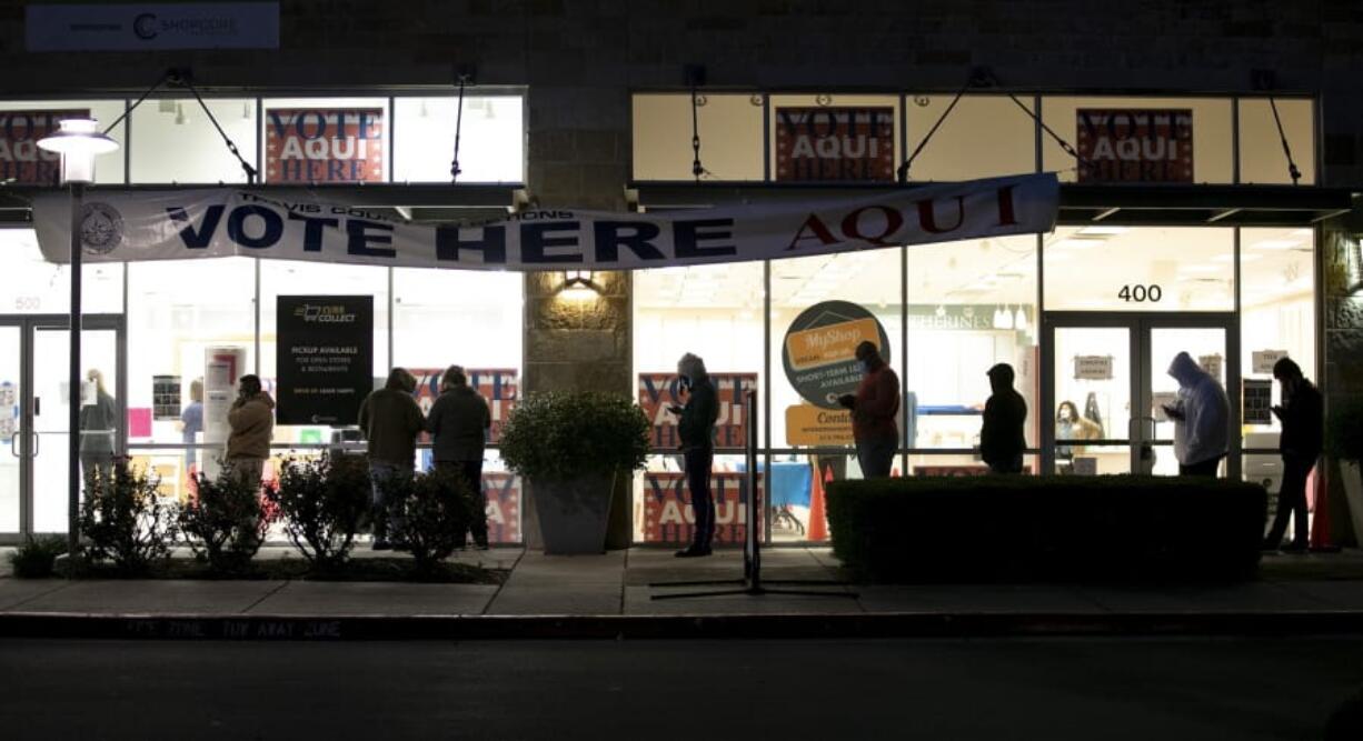 People wait in line to vote in Austin, Texas, before the polls opened at 7 a.m. on Tuesday Nov.  3, 2020.