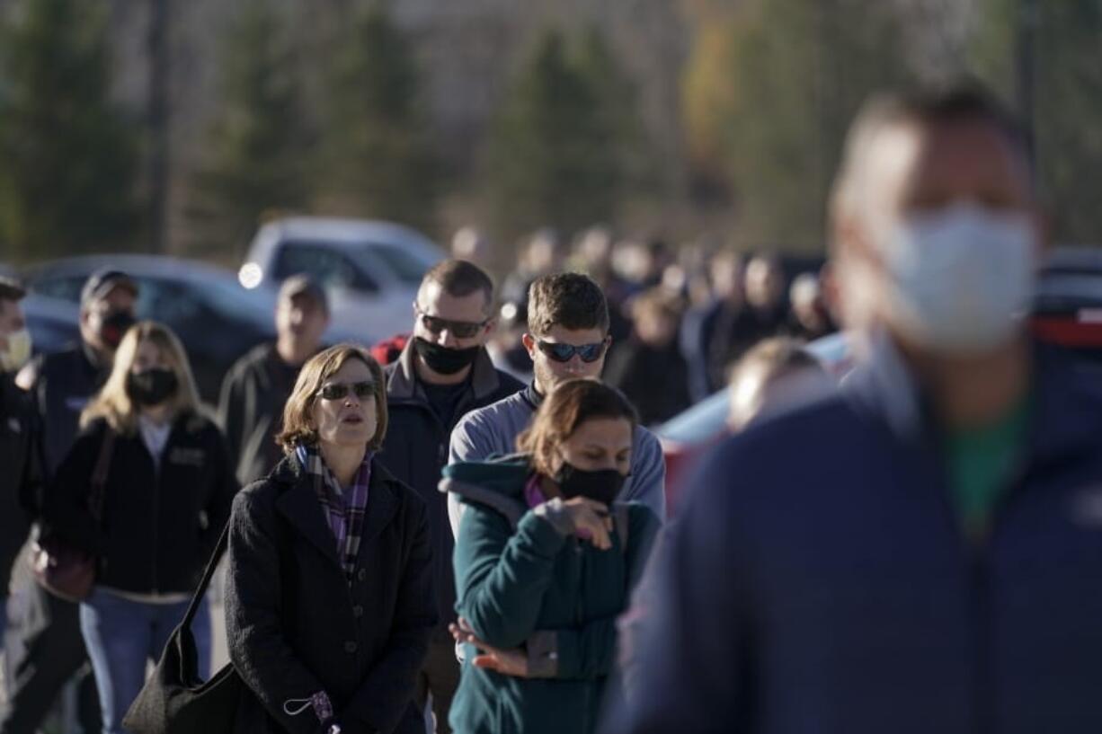 People wait in line to vote on Election Day, at the Milwaukee County Sports Complex Tuesday, Nov. 3, 2020, in Franklin, Wis.