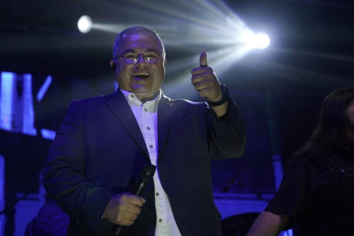 Republican Loren Culp greets a large crowd Oct. 31, 2020, at a rally near Graham. (AP Photo/Ted S.