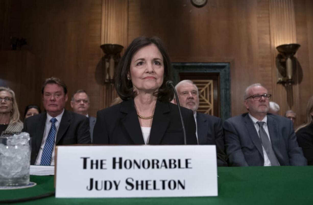 FILE - In this Feb. 13, 2020 file photo, President Donald Trump&#039;s nominee to the Federal Reserve, Judy Shelton, appears before the Senate Banking Committee for a confirmation hearing, on Capitol Hill in Washington. President Donald Trump&#039;s controversial nominee to the Federal Reserve is facing a razor-close vote in Congress. The Senate is voting Tuesday on the nomination of Judy Shelton to join the Federal Reserve&#039;s powerful board of governors. Shelton is an unusually caustic critic of the Fed and is opposed by three Republican senators. Expected absences from two other Republicans could block her from advancing in Tuesday&#039;s vote.  (AP Photo/J.