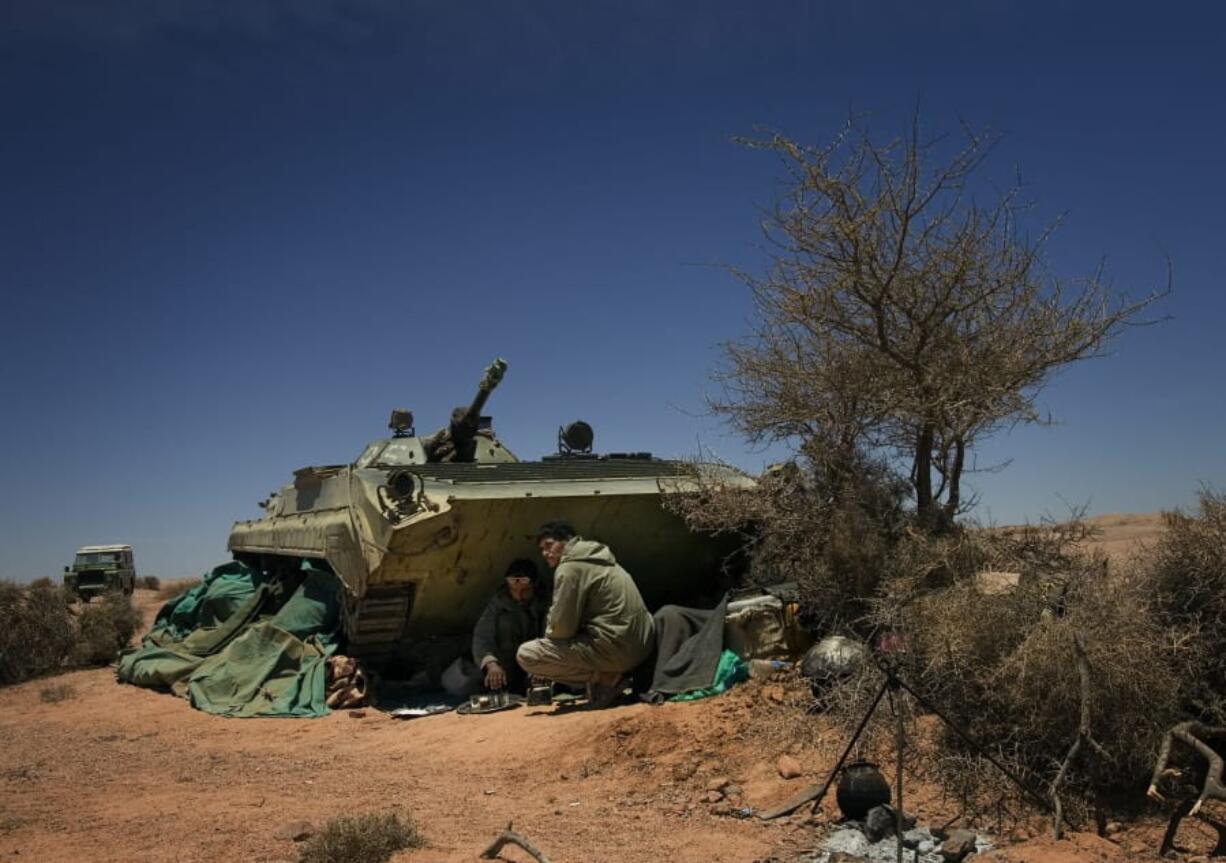 FILE - In this May 20 2008 file photo, pro-independence Polisario Front rebel soldiers prepare tea in the Western Sahara region of Tifariti. The Moroccan military has intervened in a U.N.-patrolled border zone in the disputed Western Sahara to clear a key road it said was being blockaded for weeks by supporters of the pro-independence Polisario Front.