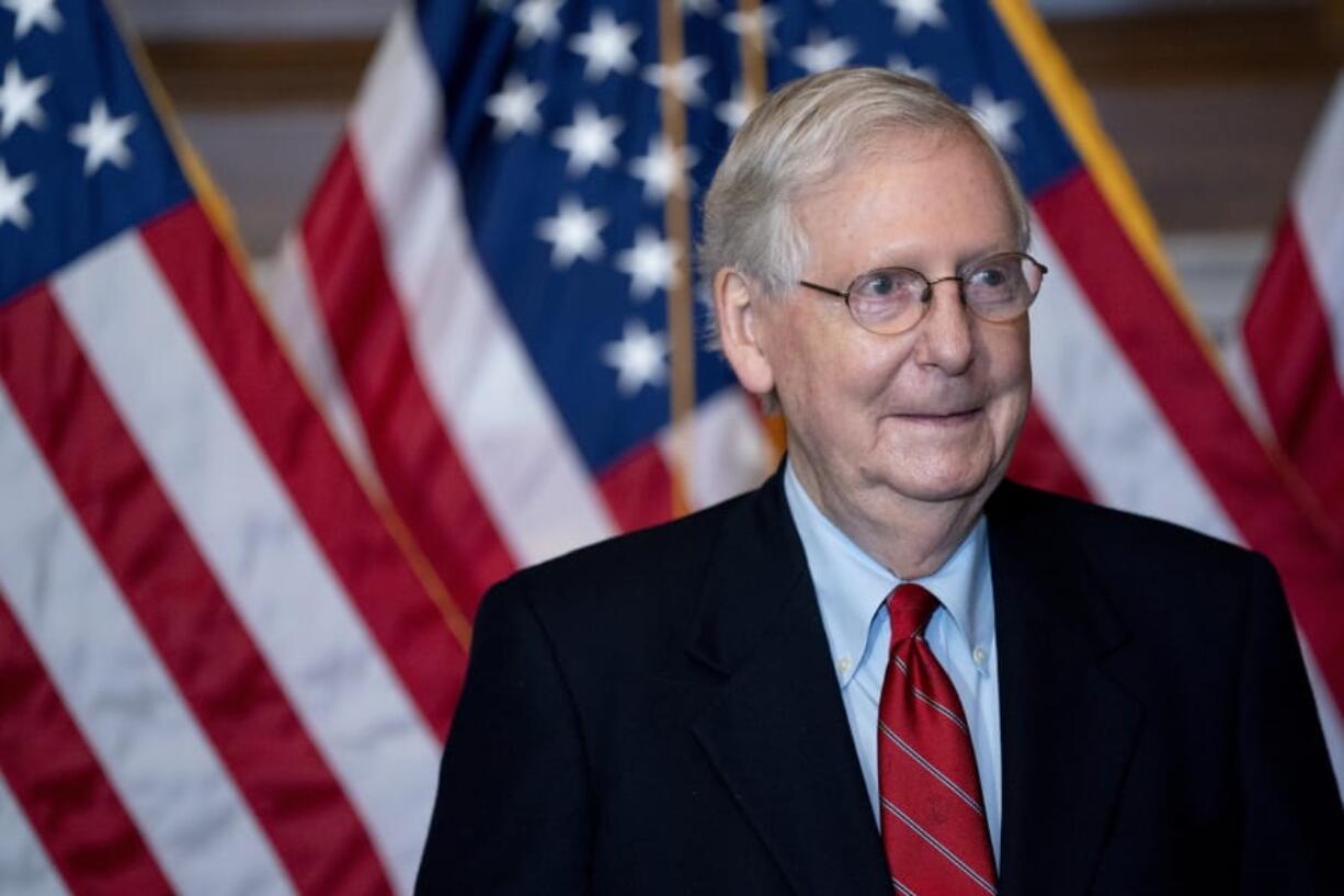 Senate Majority Leader Mitch McConnell  of Ky.,  poses with newly elected Republican senators including Sen.-elect Cynthia Lummis, R-Wyo., Sen.-elect Tommy Tuberville, R-Ala., Sen.-elect Bill Hagerty, R-Tenn., and Sen.-elect Roger Marshall, R-Kan., on Capitol Hill in Washington, Monday, Nov. 9, 2020.