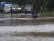 A man walks through a flooded road in Okonwas, Nicaragua, Wednesday, Nov. 4, 2020. Eta weakened from the Category 4 hurricane to a tropical storm after lashing Nicaragua&#039;s Caribbean coast for much of Tuesday, its floodwaters isolating already remote communities and setting off deadly landslides.