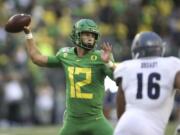 Oregon quarterback Tyler Shough, left, is a new starter along with five new offensive linemen. Expected to finish atop the Pac-12, the Ducks open at home with Stanford and will face Oregon State during the Thanksgiving weekend.