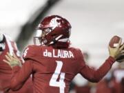 Washington State quarterback Jayden de Laura (4) throws a pass during the first half of the team&#039;s NCAA college football game against Oregon in Pullman, Wash., Saturday, Nov. 14, 2020.