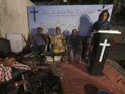 Nisara Gill, right, leads a prayer service at Pakistan&#039;s first church for transgender worshippers, in Karachi, Pakistan, Friday, Nov. 13, 2020. Transgender Pakistanis are often mocked, abused and bullied, and Christians among them are a minority within a minority, often shunned even in churches.