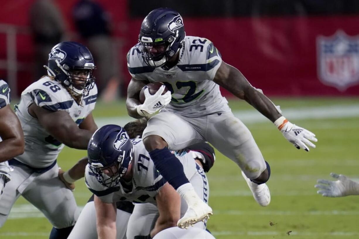 Seattle Seahawks running back Chris Carson (32) runs against the Arizona Cardinals during the first half of an NFL football game, Sunday, Oct. 25, 2020, in Glendale, Ariz. (AP Photo/Ross D.