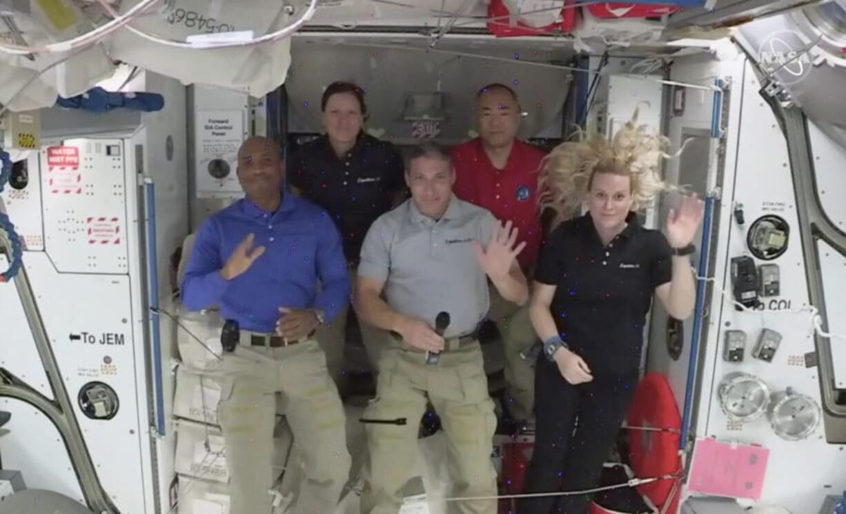 Crew -1 NASA astronauts from left to right pilot Victor Glover, mission specialist Shannon Walker, Crew Dragon commander Michael Hopkins,  Japan Aerospace Exploration Agency (JAXA) astronaut and mission specialist Soichi Noguchi and flight engineer Kate Rubins hold a news conference from aboard the International Space Station on Thursday, Nov. 19, 2020.