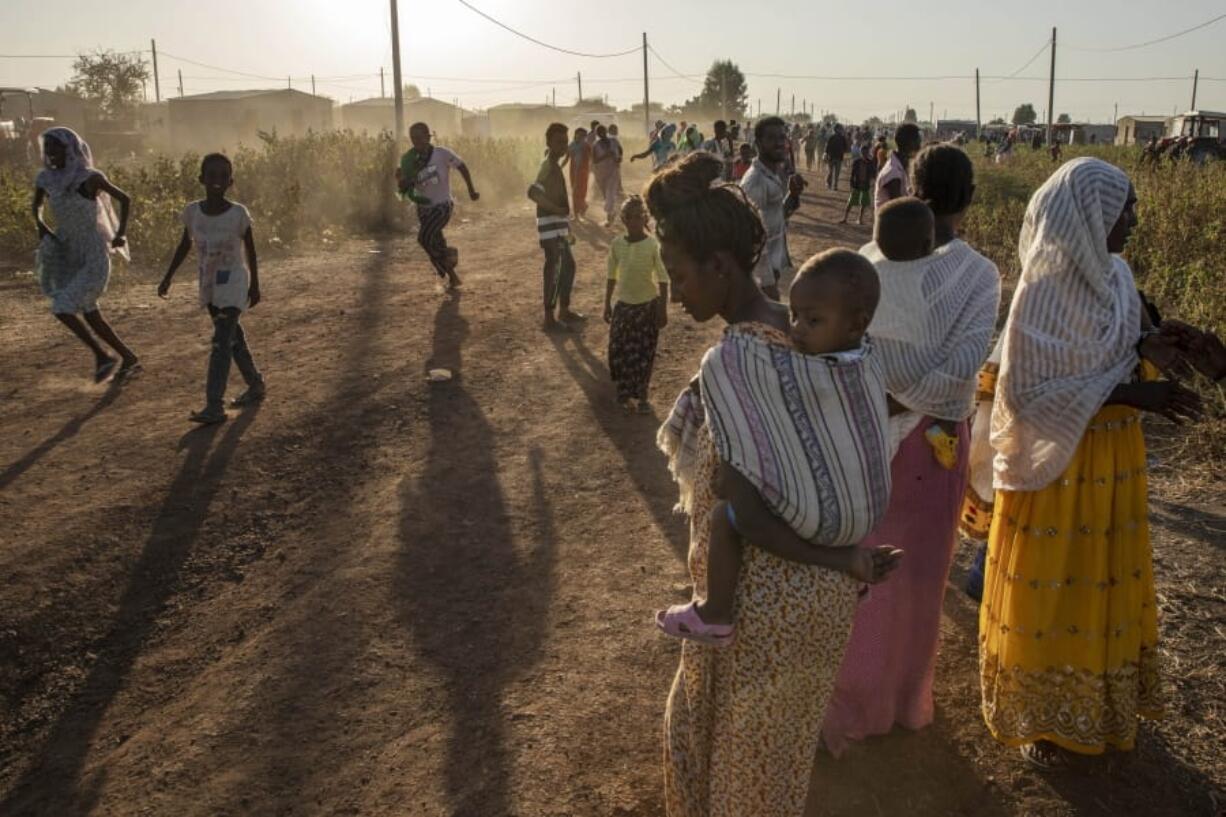 Tigray refugees who fled a conflict in the Ethiopia&#039;s Tigray region run at Village 8, the transit centre near the Lugdi border crossing, eastern Sudan on Sunday.