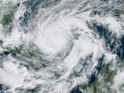 This GeoColor satellite image taken Monday, Nov. 2, 2020, at 1 p.m. EDT, and provided by NOAA, shows Hurricane Eta approaching the border of Honduras and Nicaragua. New Hurricane Eta quickly gained force Monday as it headed for Central America on the verge of becoming a major hurricane, threatening massive flooding and landslides across a vulnerable region.