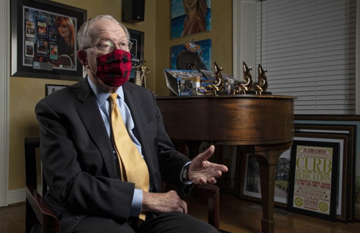 Sen. Lamar Alexander, R-Tenn., speaks from behind a face mask during an interview Friday, Nov. 20, 2020, in Nashville, Tenn.