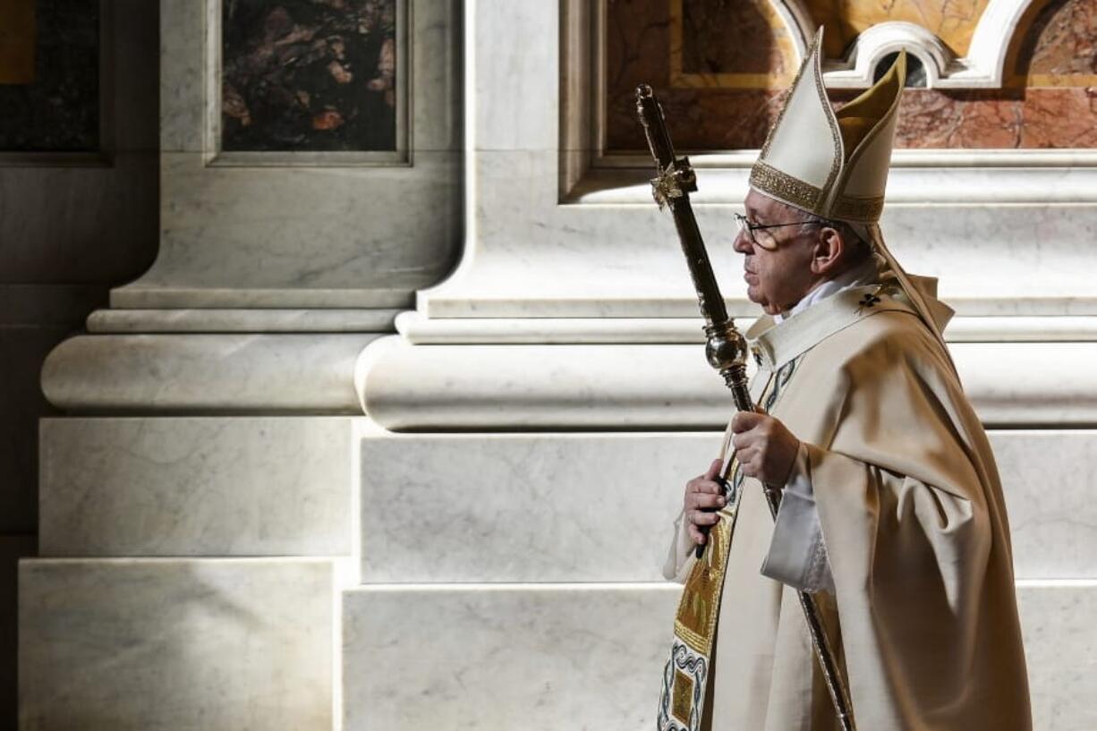 Pope Francis leaves after celebrating Mass on the occasion of the Christ the King festivity, in St. Peter&#039;s Basilica at the Vatican, Sunday, Nov. 22, 2020. At the end of the mass a delegation of youths from Panama will hand over the World Youth Day cross to youths from Portugal, where the next World Youth Day will be held in 2023.