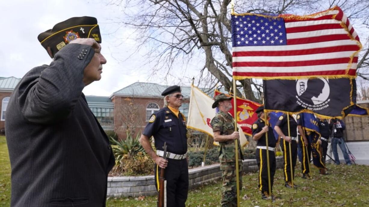 Chaplain Charles Andriolo, of VFW Post 1617, salutes during a Veteran&#039;s Day ceremony, Wednesday, Nov. 11, 2020, in Derry, N.H.