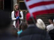 State Rep. Vicki Kraft, R-Vancouver, speaks to a crowd gathered in front of the Clark County Courthouse to protest Washington Gov. Jay Inslee's extension of coronavirus stay-at-home order in Vancouver in May 2020.