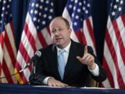 FILE - Colorado Gov. Jared Polis speaks during a news conference about the state&#039;s response to the rapid increase in COVID-19 cases, Tuesday, Nov. 24, 2020, in Denver.  Faulting inaction in Washington, governors and state lawmakers are racing to get needed pandemic relief to small businesses, the unemployed, renters and others affected by the widening coronavirus outbreak.