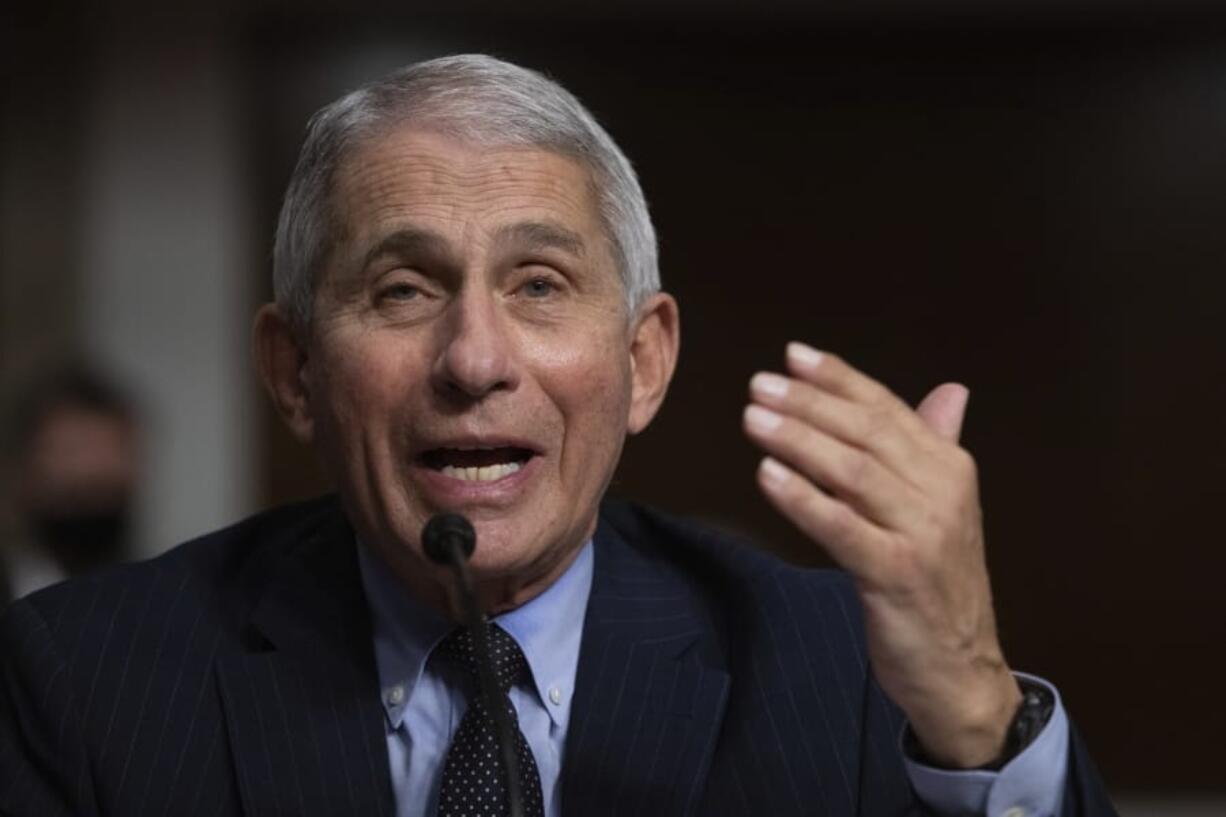 FILE - In this Sept. 23, 2020 file photo, Dr. Anthony Fauci, Director of the National Institute of Allergy and Infectious Diseases at the National Institutes of Health, listens during a Senate Senate Health, Education, Labor, and Pensions Committee Hearing on the federal government response to COVID-19 Capitol Hill in Washington. Fauci says, Thursday, Nov.