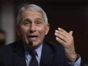 FILE - In this Sept. 23, 2020 file photo, Dr. Anthony Fauci, Director of the National Institute of Allergy and Infectious Diseases at the National Institutes of Health, listens during a Senate Senate Health, Education, Labor, and Pensions Committee Hearing on the federal government response to COVID-19 Capitol Hill in Washington. Fauci says, Thursday, Nov.