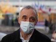 Dr. Philippe Montravers speaks with The Associated Press at the main entrance of the Bichat Hospital, in Paris on Tuesday, Nov. 10, 2020. Montravers and the 150 doctors and nurses he leads have become experts about how to treat COVID-19. That knowledge is proving invaluable against a second deadly surge of the virus is again threatening to overwhelm European health systems.