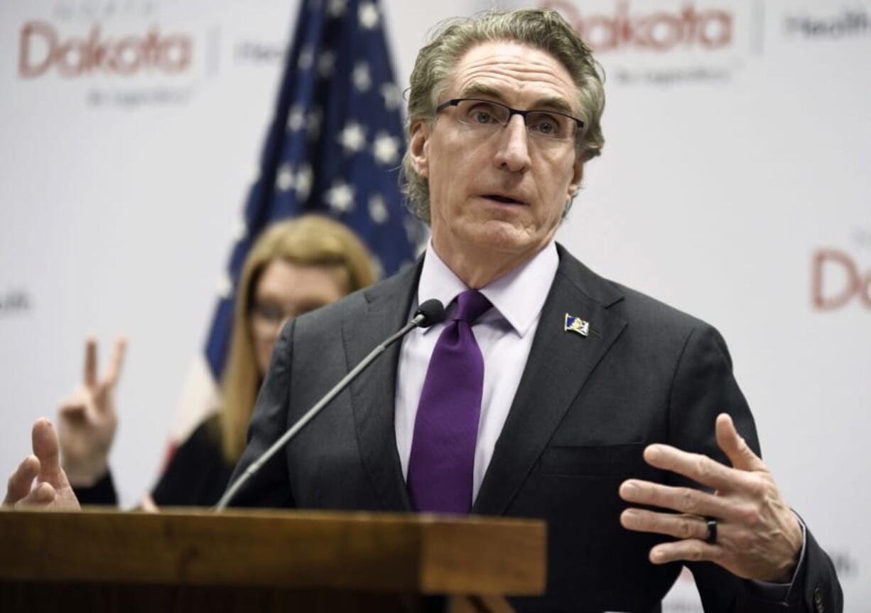 FILE - In this April 10, 2020, file photo, North Dakota Gov. Doug Burgum speaks at the state Capitol in Bismarck, N.D. After months of resisting ordering the people of North Dakota to wear masks and limit the size of gatherings, the state&#039;s Republican governor has relented in an effort to stem a coronavirus surge that is among the worst in the U.S. Gov. Burgum&#039;s executive order Friday night, Nov. 13, 2020, came as a surprise.