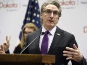 FILE - In this April 10, 2020, file photo, North Dakota Gov. Doug Burgum speaks at the state Capitol in Bismarck, N.D. After months of resisting ordering the people of North Dakota to wear masks and limit the size of gatherings, the state&#039;s Republican governor has relented in an effort to stem a coronavirus surge that is among the worst in the U.S. Gov. Burgum&#039;s executive order Friday night, Nov. 13, 2020, came as a surprise.