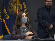 Oregon Gov. Kate Brown attends a news conference Tuesday, Nov. 10, 2020, in Portland, Ore. Brown and Oregon health officials warned Tuesday of the capacity challenges facing hospitals as COVID-19 case counts continue to spike in the state.