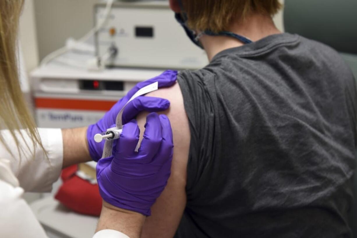 FILE - This May 4, 2020, file photo provided by the University of Maryland School of Medicine, shows the first patient enrolled in Pfizer&#039;s COVID-19 coronavirus vaccine clinical trial at the University of Maryland School of Medicine in Baltimore.  Pfizer announced Wednesday, Nov. 18, 2020, more results in its ongoing coronavirus vaccine study that suggest the shots are 95% effective a month after the first dose.