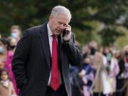 In this Oct. 30, 2020, photoWhite House chief of staff Mark Meadows speaks on a phone on the South Lawn of the White House in Washington. Meadows has been diagnosed with coronavirus.