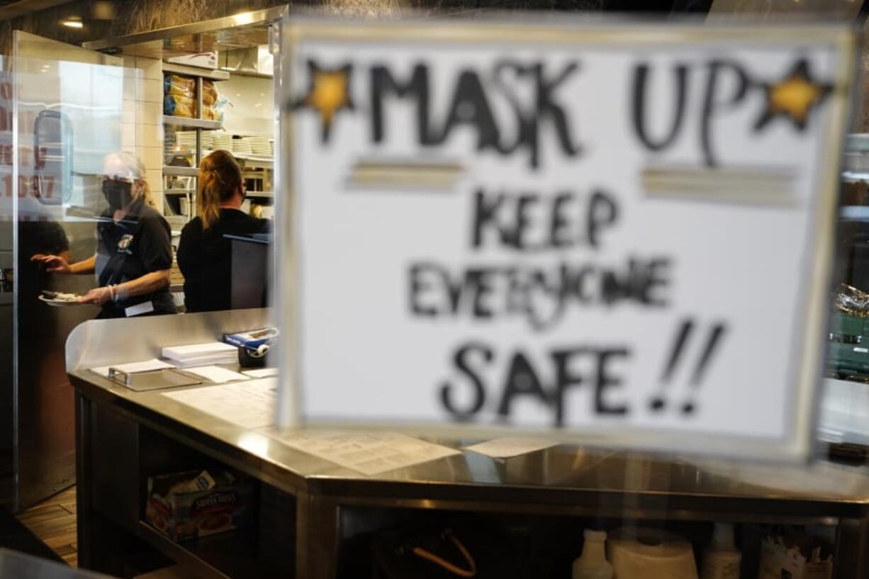 Waitress Kim Iannacone, left, and manager Yllka Murati gather food orders at the Penrose Diner, Tuesday, Nov. 17, 2020, in south Philadelphia. Philadelphia plans to prohibit indoor dining at restaurants, shutter casinos, gyms, museums and libraries, pause in-person instruction at colleges and high schools, and reduce occupancy at stores and religious institutions, the health commissioner, Dr. Thomas Farley, said at a news conference Monday as the city battles a resurgence of the coronavirus. (AP Photo/Matt Slocum) (gene j.