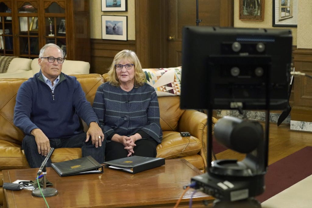 Washington Gov. Jay Inslee and his wife, Trudi, rehearse in the governor's office as they prepare to make a statewide televised address on COVID-19, which health officials have warned is accelerating rapidly throughout the state, Thursday, Nov. 12, 2020, at the Capitol in Olympia, Wash. (AP Photo/Ted S.