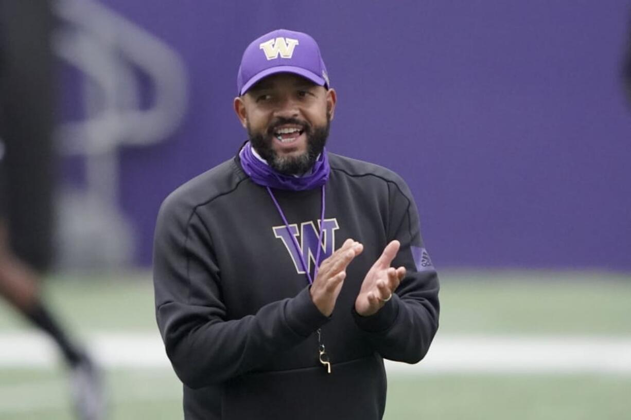 Washington head coach Jimmy Lake has four options at quarterback as the Huskies prepare to open their abbreviated season against California on Saturday. (Ted S.