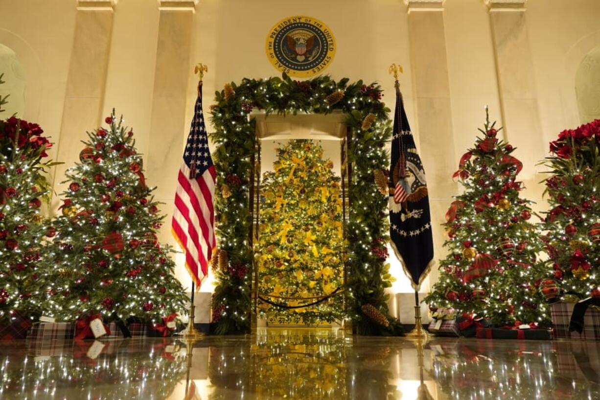 Cross Hall and the Blue Room are decorated during the 2020 Christmas preview at the White House, Monday, Nov. 30, 2020, in Washington.