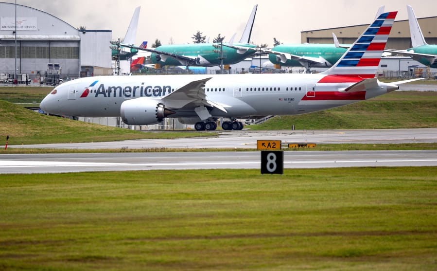 A new Boeing 787-8 Dreamliner, built for American Airlines, is seen moving along the runway at Paine Field in Everett, Washington in November 2020. The 787 final assembly facility is just across the street from Paine Field.