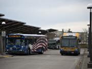 Buses make their way into the C-Tran 99th Street Station while preparing to unload passengers on Thursday morning.