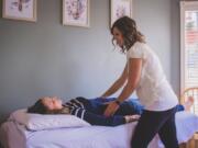 Christina Trautman, 35, assesses a patient by doing an abdominal exam. She assesses rib cage mobility and angle, tone of abdominals and checks breathing, among other things, to determine appropriate treatment for women experiencing pelvic floor issues. &quot;Literally everything you do during the day it requires some type of pelvic floor function. All of those things require stabilization and support,&quot; Trautman said.