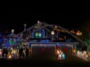 At the Buchanan home at 15309 N.E. 7th St., Vancouver, thousands of colorful lights illuminate the night sky.