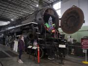 Renee Devereux of the Oregon Rail Heritage Center takes in the view of the SP&amp;S 700, a steam locomotive that ran thousands of passenger trains through the Columbia River Gorge. It&#039;s been out of service since 2015 due to a federally required boiler inspection and maintenance. It may run again in 2021. At top, the SP&amp;S 700 is equipped with eight drive wheels, each 77 inches in diameter.