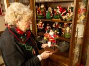 Joanna Hamnes, 79, talks about her Norwegian-style Santa figurine. Her collection includes Santas in costumes from around the world.