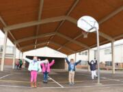 BATTLE GROUND: Kindergartners at Maple Grove Primary School under the new covered play structure.