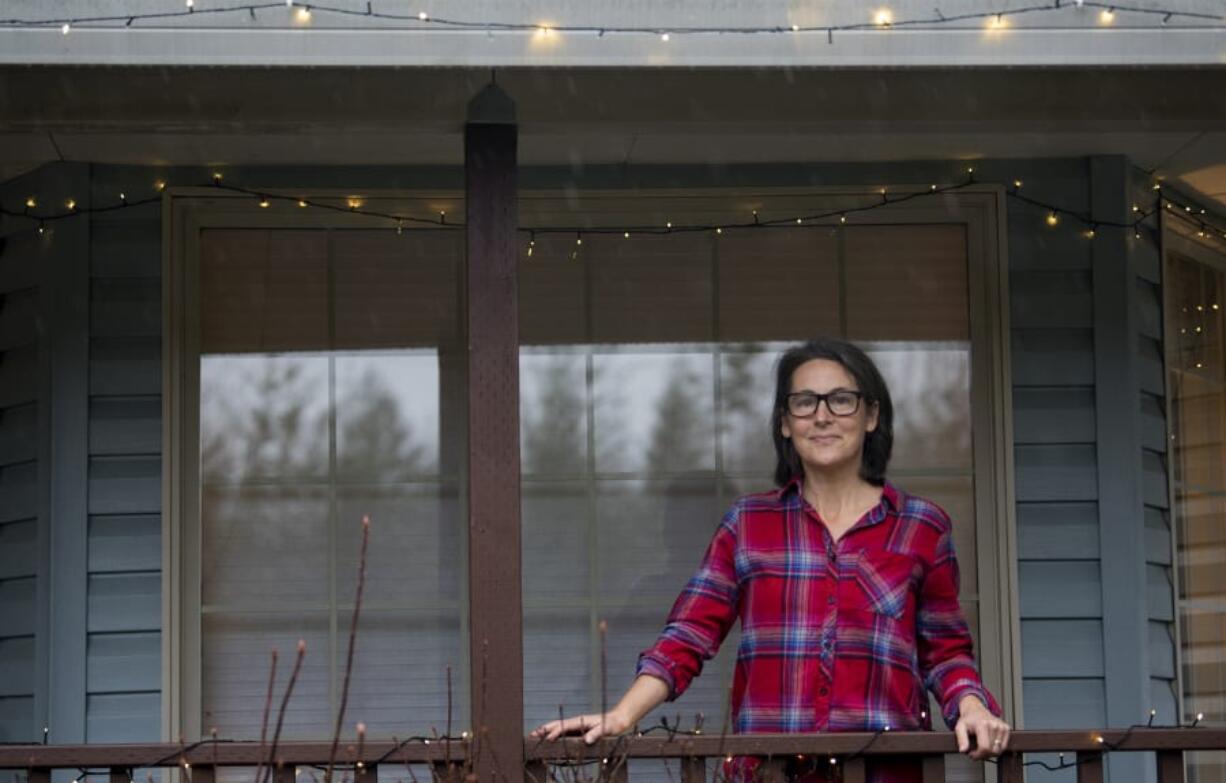 Karen Kennedy of La Center, who is a self-employed nutritionist, pauses for a portrait at her home.