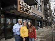 Rob Griffin, from left, and his wife, Deborah Barnard, pause for a portrait with their daughter, Megan Hughes, outside the new Barnard Griffin tasting room at The Waterfront Vancouver.