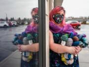 Eden Scheans holds bundles of yarn at Blizzard Yarn and Fiber in Vancouver. The store, at 6924 N.E. Fourth Plain Boulevard, is struggling to stay afloat during the pandemic.