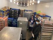 WASHOUGAL: Glenda Huddleston, Linda Manire and Molly Krabbenhoft with Washougal School District food services help prepare meal kits. An extension of U.S.