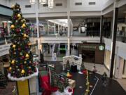 A colorful Christmas tree adds a festive touch for shoppers and workers at Vancouver Mall. Despite COVID-19 occupancy restrictions, general manager Tracy Peters said, the mall has done relatively well during the current holiday shopping season.