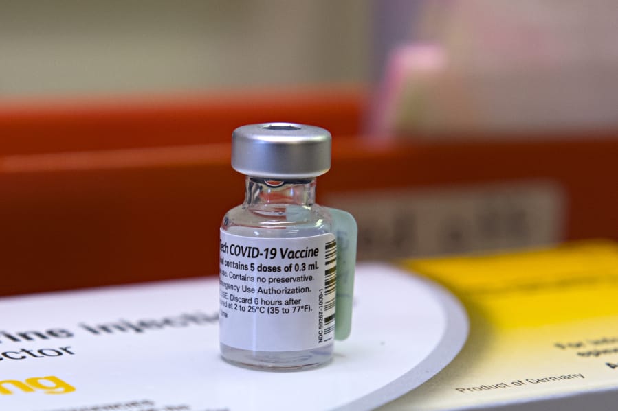 A vial with the COVID-19 vaccine is pictured at PeaceHealth Urgent Care Memorial on Tuesday morning, December 22, 2020.