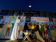 Claremont United Methodist Church put up a Nativity scene that shows Mary, Joseph and baby Jesus in front of a wall of people wearing masks and carrying signs that read CfuBlack Lives Matter,Cfu CfuI canCfUt breatheCfu and CfuJesus wept,Cfu along with Bible verses.